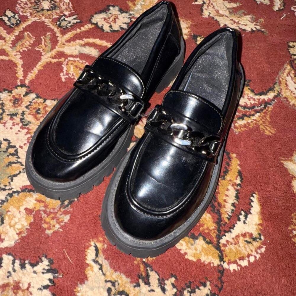 Black chunky loafers with chain